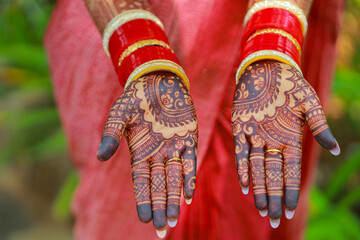 Beautifully designed mehendi henna on hands as a part of  tradition