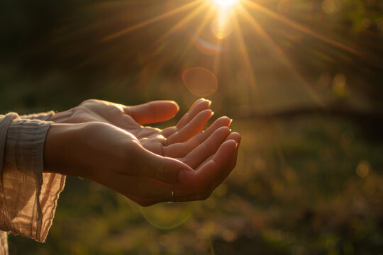 Person practicing reiki in the golden hour sunlight