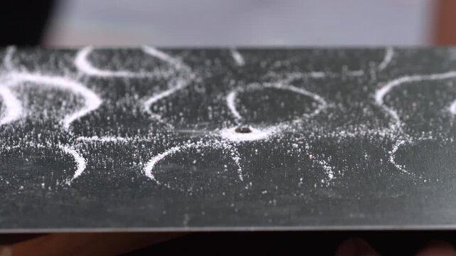 Moving Sand On The Surface Of Chladni Plate - Close Up Shot