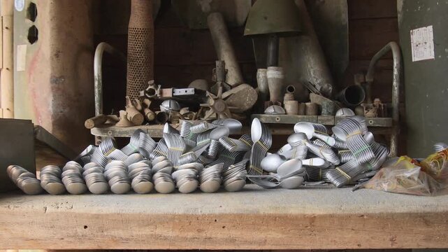 Ban Napia, Laos - 15th january, 2024: aluminum spoons produced from UXO or unexploded bombs in Laos. USA bombings of Laos during Vietnam war era concept