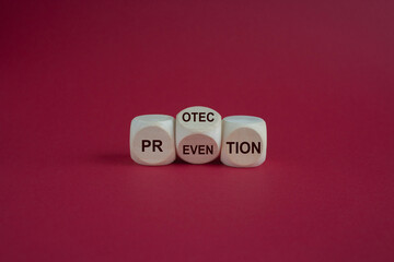 Protection and prevention symbol. Concept word Protection Prevention on wooden cubes. Beautiful pink background. Business and protection and prevention concept.
