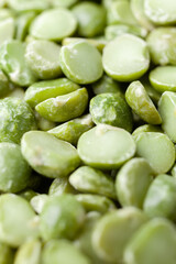Uncooked, split, green peas background. Dry peas grains. Close-up