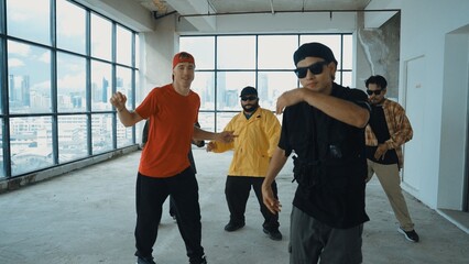Multicultural dancer practice street dance and move to hip-hop music. Professional hipster group...