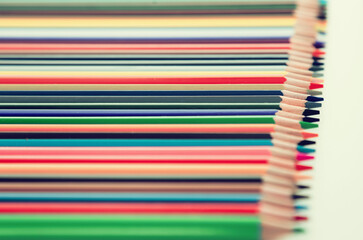 Colored pencils lying in row