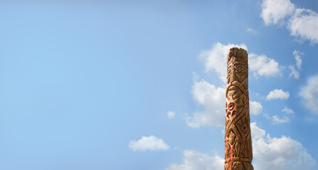 Old wooden idol in the field