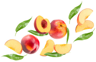 flying cuts of peach fruit with green leaf isolated on white background. clipping path