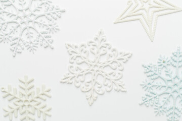 Beautiful snowflake on color background, top view