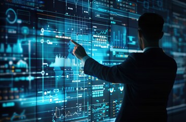 Businessman Analyzing Data on Large Screen Display