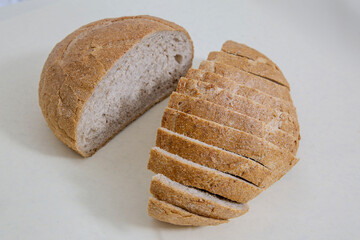 Slice of Sourdough Bread isolated on white background. Piece of yeast rye or wheat artisan bread, design element.
