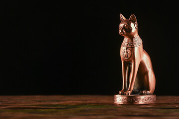 Ancient Egypt goddess Bast (Bastet) silluethe in the lights close up.