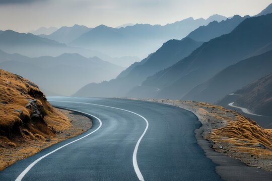 High-angle shot of a winding asphalt road through mountains, capturing the twists and turns, dynamic perspective - Powered by Adobe