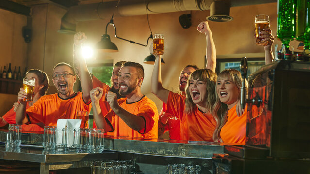 Football enthusiasts shouting of joy and happiness, celebrate at bar, raising their beers and cheering, victory of favorite sport team. Concept of friendship, soccer fan, championship, support. Ad