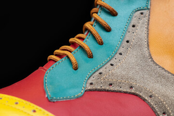 Close up colorful stylish shinny leather dress shoes on shelf at store. Men fashion clothing,...