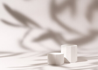 Cosmetics product presentation mockup scene made with three white pillars podium stage in leaves shadow. Ideal for showcasing cosmetics, perfumery, jewelry and branding visuals. Studio photography.