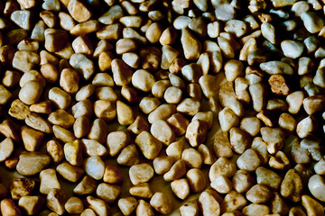 Light brown pebbles stones,positive tone,abstract background