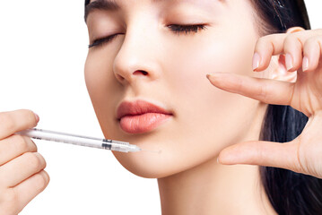 Fototapeta premium Beautiful woman has an injections in chin.