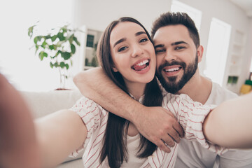 Photo of happy young couple move new place enjoy live together take selfie photo have fun new apartment room light house flat indoor