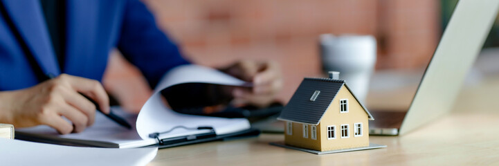 Fototapeta premium Real estate broker with contract insurance agreement document