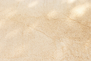 Shadow Pattern on Sand background, Natural light creates shadow pattern on sandy beach. Summer time concept, nature backdrop. Top view texture, empty space