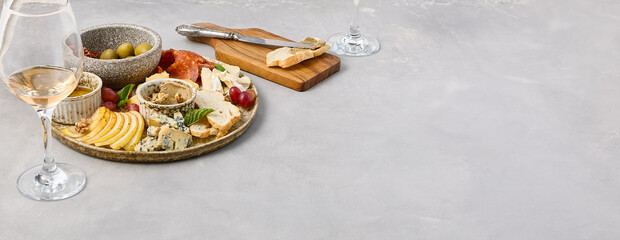 Elegant Wine Pairing Platter with Cheese, Olives, Sun-Dried Tomatoes, Pear, Honey, Fuet Sausage, and Pâte