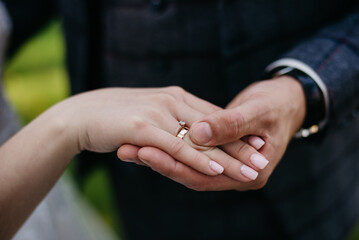 Hand in hand on a green background. Wedding card. Certificate for Valentine's Day