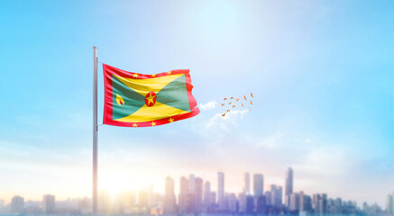 Grenada national flag waving with skyline and buildings. Grenada national flag for independence day.