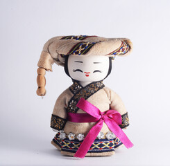 Chinese ethnic minority male doll with white background.