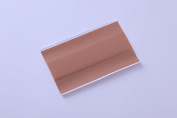 Single large bandage plaster on white background