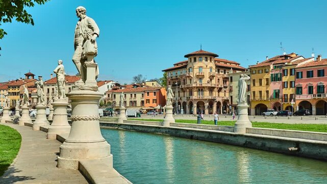 PADUA, ITALY - APRIL 17 2018: Statues of Pietro Danieletti with Gianbattista Morgagni, Rainiero Vasco, Francesco Morosini and Galileo Galilei. Prato della Valle is elliptical square in Padova, Italy.