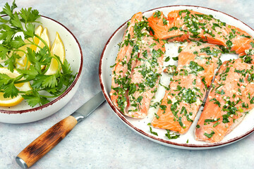 Uncooked marinated salmon or trout.