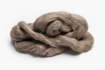 A skein of natural goat wool, isolated on a white background, close-up.