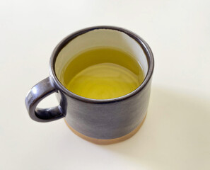 tea from glass teapot on wooden serving tray, Tea making process, Glass teapot at the tea ceremony close up, A cup of balance filled with tea, Healthy fermented puerh herbal teachinese ceremony