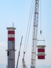 Hydrogen Refinery Under Construction with Prominent Chimney in the Foreground