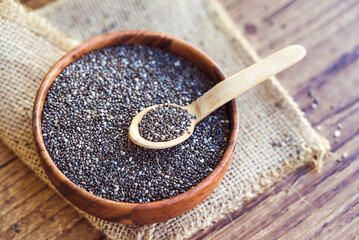 Chia seeds in wooden bowl