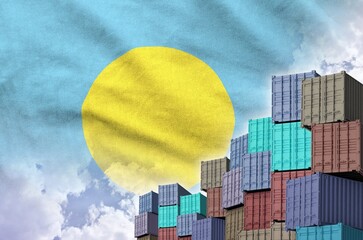 Palau flag and big stack of shipping cargo containers in docks with sky background close up