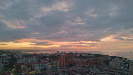 Obraz premium Drone coastal resort sunset. Aerial view stunning cozy city placed ocean shore