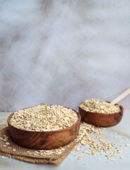 Oats in wooden bowl . Healthy food