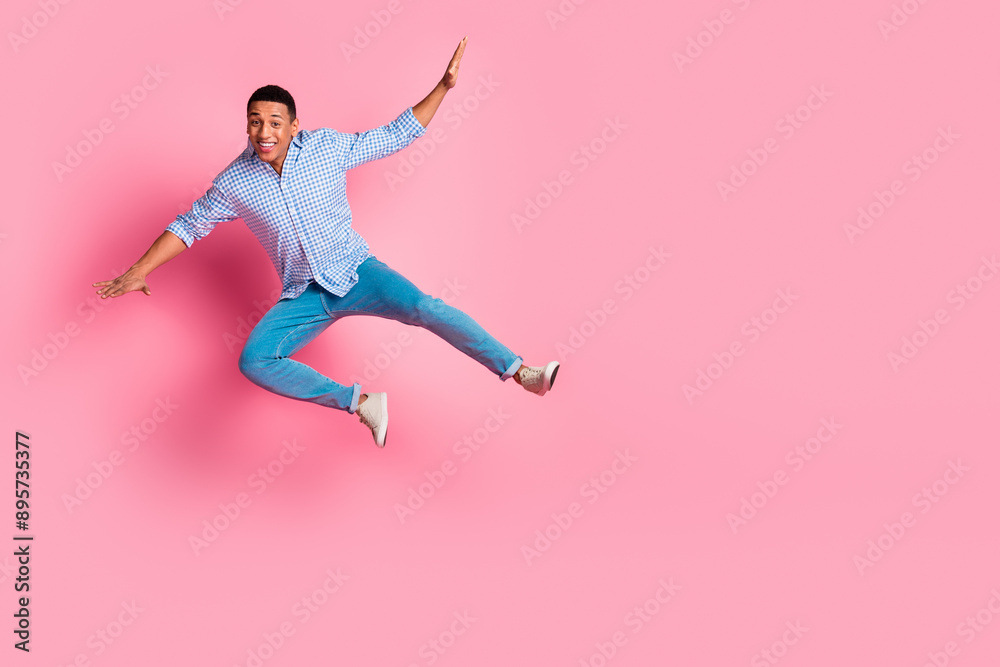 Sticker Full length photo of funky impressed guy dressed checkered shirt jumping falling emtpy space isolated pink color background