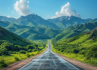 Obraz premium Asphalt Road Leading Through Green Mountains