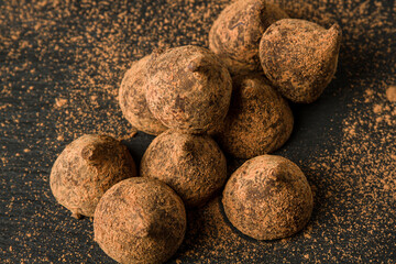 Chocolate truffles on a black background. Chocolate candy