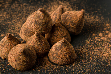 Chocolate truffles on a black background. Chocolate candy