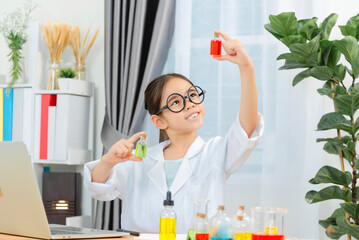 Young Girl Scientist Conducting Experiments in Laboratory Setting