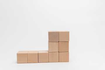 Wooden Blocks Arranged In Ascending Order On White Background