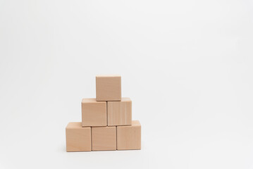 Wooden Blocks Arranged In Ascending Order On White Background