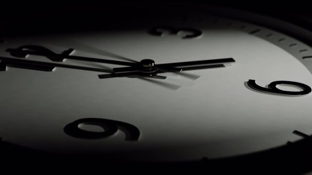 Close-up macro shot time-lapse of black and white classic wall clock at night