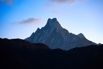 the sunrise of Machapuchare with dramatic sky at poon hill