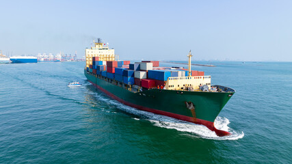 logistic cargo container ship sailing in sea import export goods and distributing products to...