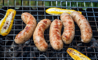 Sausages grilled on charcoal.