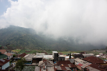 Breathtaking Hill View Emerging from a Blanket of Fog
