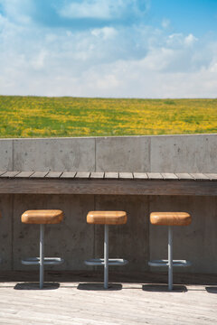 The Estonian Road Museum, open air museum grounds with exhibition and buildings. A roof terrace with a row of stools.
